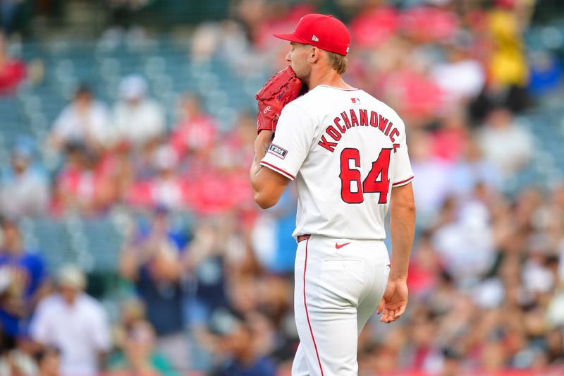 Jul 11, 2024; Anaheim, California, USA; Los Angeles Angels pitcher Jack Kochanowicz (64) reacts against the Seattle Mariners during the first inning at Angel Stadium. Mandatory Credit: Gary A. Vasquez-USA TODAY Sports