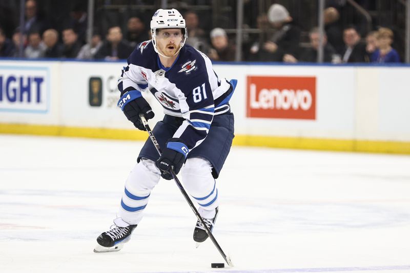 Nov 12, 2024; New York, New York, USA;  Winnipeg Jets left wing Kyle Connor (81) controls the puck in the first period against the New York Rangers at Madison Square Garden. Mandatory Credit: Wendell Cruz-Imagn Images