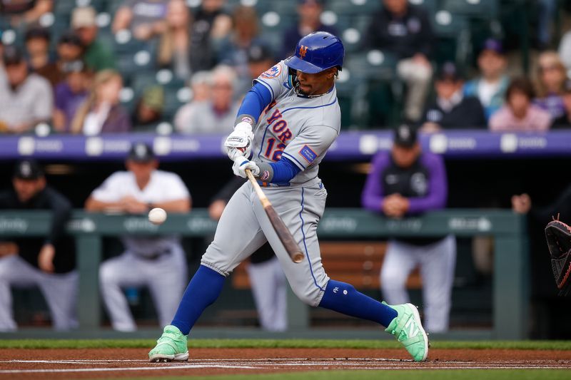 May 26, 2023; Denver, Colorado, USA; New York Mets shortstop Francisco Lindor (12) hits a two run home run in the first inning against the Colorado Rockies at Coors Field. Mandatory Credit: Isaiah J. Downing-USA TODAY Sports