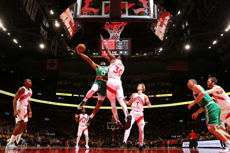 TORONTO, CANADA - OCTOBER 15: Jayson Tatum #0 of the Boston Celtics drives to the basket during the game against the Toronto Raptors on October 15, 2024 at the Scotiabank Arena in Toronto, Ontario, Canada.  NOTE TO USER: User expressly acknowledges and agrees that, by downloading and or using this Photograph, user is consenting to the terms and conditions of the Getty Images License Agreement.  Mandatory Copyright Notice: Copyright 2024 NBAE (Photo by Vaughn Ridley/NBAE via Getty Images)