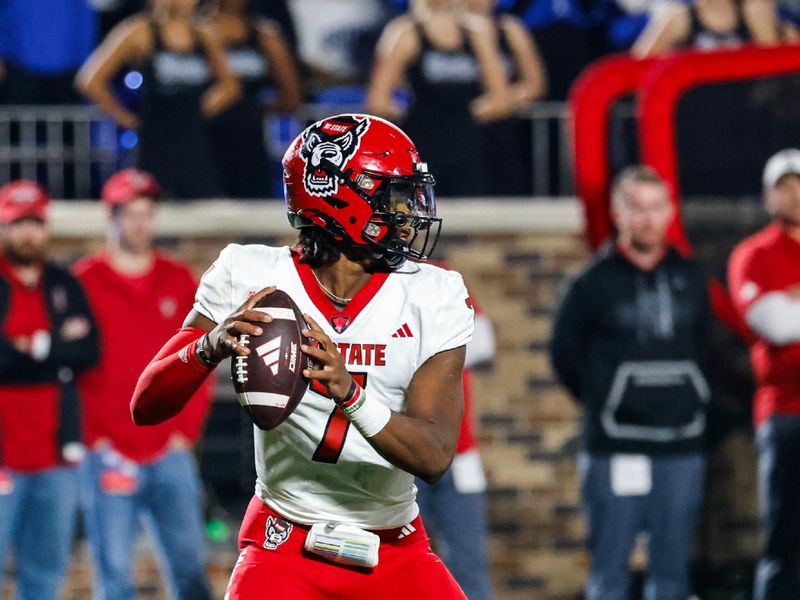 Oct 14, 2023; Durham, North Carolina, USA; North Carolina State Wolfpack quarterback MJ Morris (7) gets ready to throw the football during the first half of the game against Duke Blue Devils at Wallace Wade Stadium. Mandatory Credit: Jaylynn Nash-USA TODAY Sports