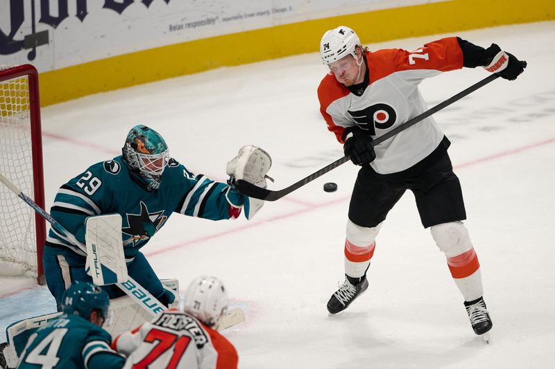 Nov 7, 2023; San Jose, California, USA; Philadelphia Flyers right wing Tyson Foerster (71) deflects a shot toward the goal against San Jose Sharks goaltender Mackenzie Blackwood (29) during the third period at SAP Center at San Jose. Mandatory Credit: Robert Edwards-USA TODAY Sports