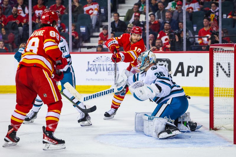 Apr 12, 2023; Calgary, Alberta, CAN; San Jose Sharks goaltender Kaapo Kahkonen (36) makes a save against the Calgary Flames during the third period at Scotiabank Saddledome. Mandatory Credit: Sergei Belski-USA TODAY Sports