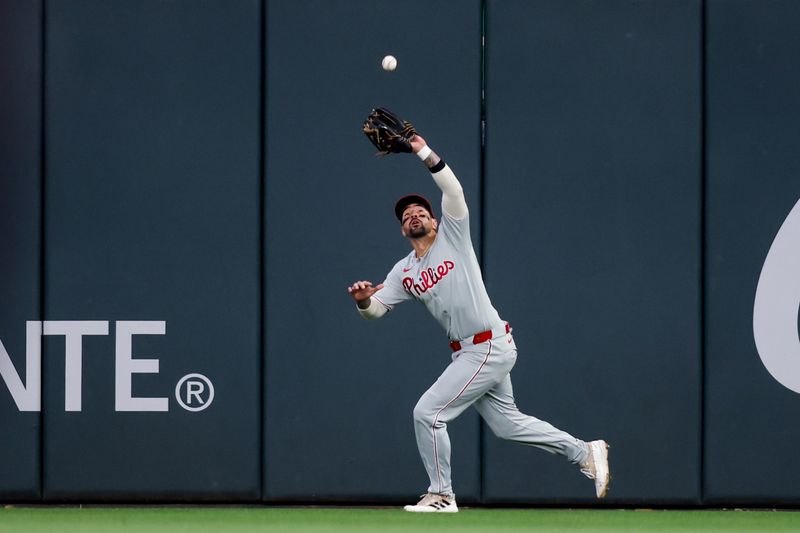 Apr 10, 2025; Atlanta, Georgia, USA; Philadelphia Phillies right fielder Nick Castellanos (8) catches a fly ball against the Atlanta Braves in the fifth inning at Truist Park. Mandatory Credit: Brett Davis-Imagn Images