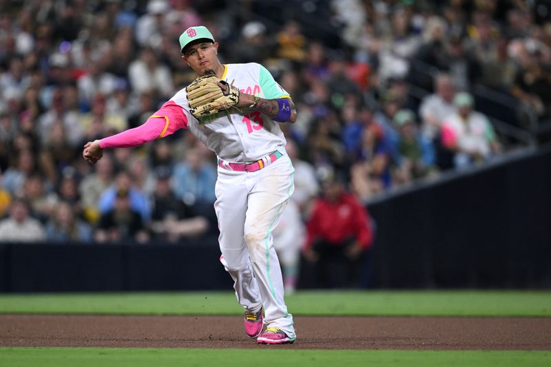 Jul 7, 2023; San Diego, California, USA; San Diego Padres third baseman Manny Machado (13) throws to first base on a ground out by New York Mets right fielder Starling Marte (not pictured) during the seventh inning at Petco Park. Mandatory Credit: Orlando Ramirez-USA TODAY Sports