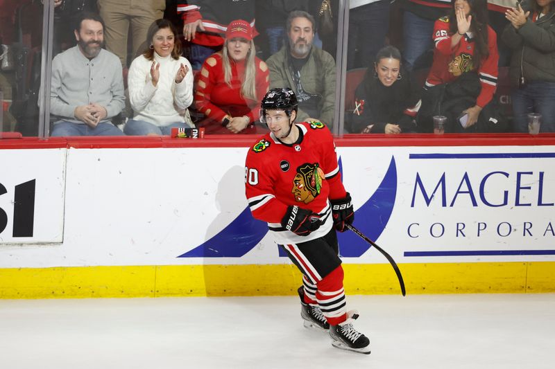 Feb 23, 2024; Chicago, Illinois, USA; Chicago Blackhawks center Tyler Johnson (90) smiles after scoring against the Winnipeg Jets during the third period at United Center. Mandatory Credit: Kamil Krzaczynski-USA TODAY Sports