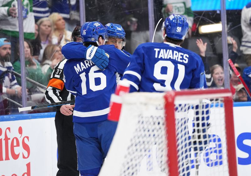 Apr 13, 2024; Toronto, Ontario, CAN; Toronto Maple Leafs right wing Mitch Marner (16) scores a gaol and celebrates with right wing William Nylander (88) during the first period against the Detroit Red Wings at Scotiabank Arena. Mandatory Credit: Nick Turchiaro-USA TODAY Sports