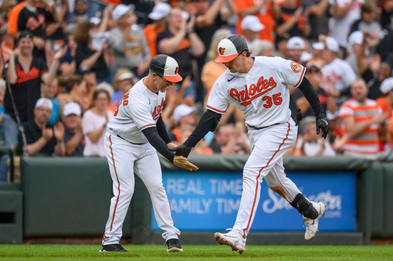 Sep 17, 2023; Baltimore, Maryland, USA; Baltimore Orioles catcher Adley Rutschman (35) hits a home during the eighth inning against the Tampa Bay Rays at Oriole Park at Camden Yards. Mandatory Credit: Reggie Hildred-USA TODAY Sports