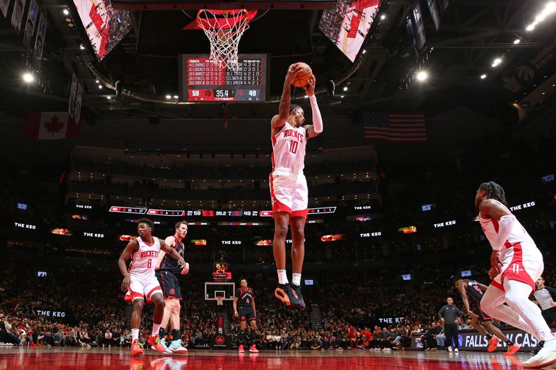 TORONTO, CANADA - FEBRUARY 9: Jabari Smith Jr. #10 of the Houston Rockets rebounds during the game against the Toronto Raptors on February 9, 2024 at the Scotiabank Arena in Toronto, Ontario, Canada.  NOTE TO USER: User expressly acknowledges and agrees that, by downloading and or using this Photograph, user is consenting to the terms and conditions of the Getty Images License Agreement.  Mandatory Copyright Notice: Copyright 2024 NBAE (Photo by Vaughn Ridley/NBAE via Getty Images)