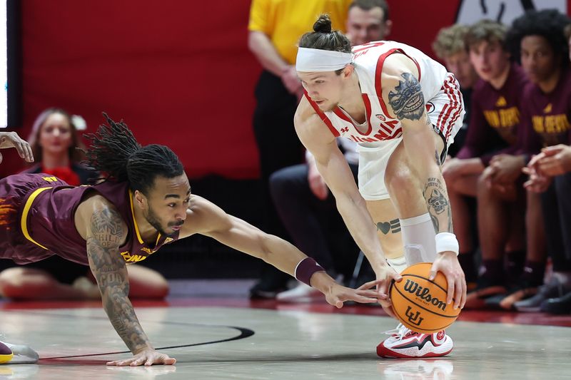 Feb 10, 2024; Salt Lake City, Utah, USA; Arizona State Sun Devils guard Frankie Collins (1) dives for a ball with Utah Utes guard Gabe Madsen (55) during the first half at Jon M. Huntsman Center. Mandatory Credit: Rob Gray-USA TODAY Sports