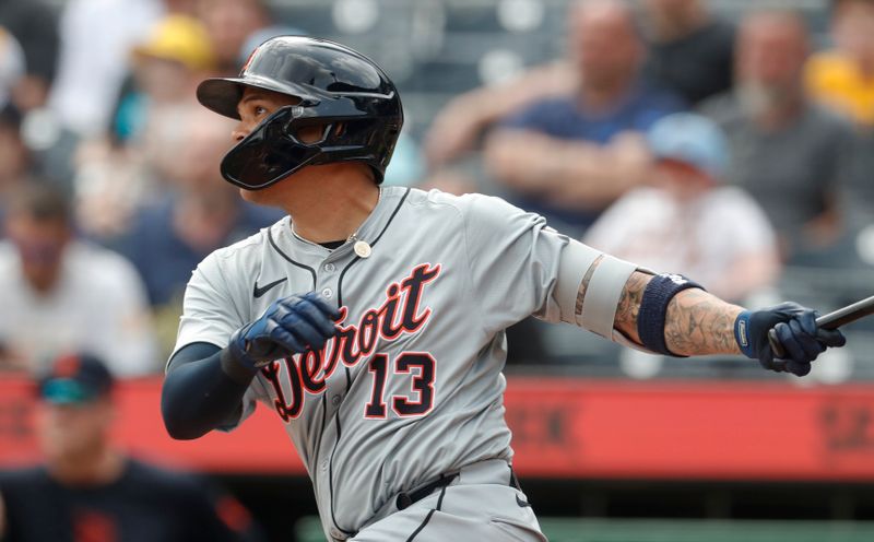 Apr 9, 2024; Pittsburgh, Pennsylvania, USA;  Detroit Tigers third baseman Gio Urshela (13) hits an RBI ingle against the Pittsburgh Pirates during the ninth inning at PNC Park. Detroit won 5-3. Mandatory Credit: Charles LeClaire-USA TODAY Sports