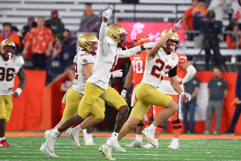 Nov 3, 2023; Syracuse, New York, USA; Boston College Eagles defensive back Cole Batson (23) celebrates his interception against the Syracuse Orange during the second half at the JMA Wireless Dome. Mandatory Credit: Rich Barnes-USA TODAY Sports