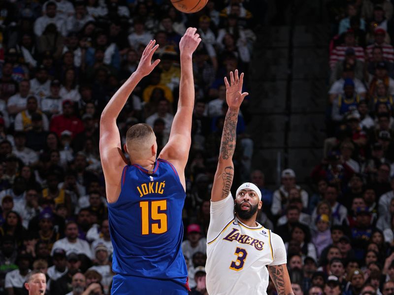 DENVER, CO - APRIL 20: Nikola Jokic #15 of the Denver Nuggets shoots the ball during the game against the Los Angeles Lakers during Round 1 Game 1 of the 2024 NBA Playoffs on April 20, 2024 at the Ball Arena in Denver, Colorado. NOTE TO USER: User expressly acknowledges and agrees that, by downloading and/or using this Photograph, user is consenting to the terms and conditions of the Getty Images License Agreement. Mandatory Copyright Notice: Copyright 2024 NBAE (Photo by Garrett Ellwood/NBAE via Getty Images)