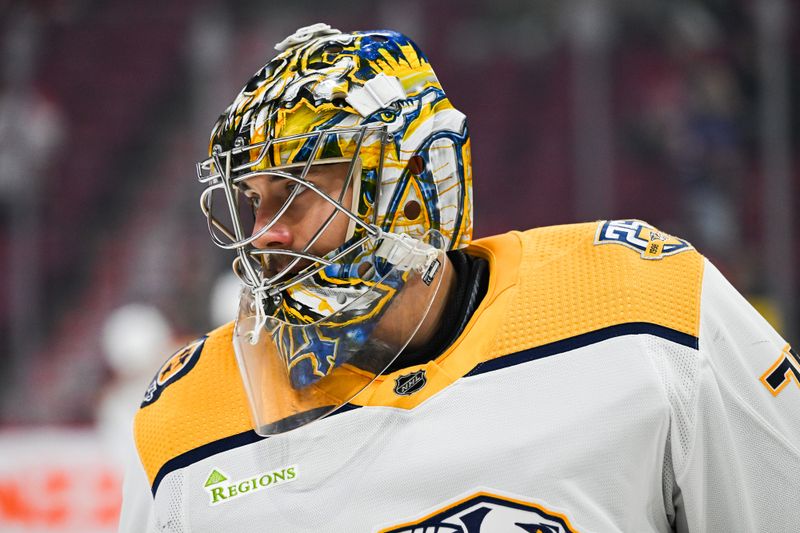 Dec 10, 2023; Montreal, Quebec, CAN; Nashville Predators goalie Juuse Saros (74) looks on during warm-up before the game against the Montreal Canadiens at Bell Centre. Mandatory Credit: David Kirouac-USA TODAY Sports