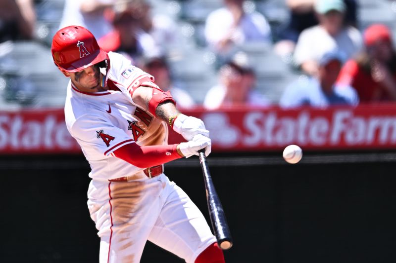 Aug 4, 2024; Anaheim, California, USA; Los Angeles Angels shortstop Zach Neto (9) triples against the New York Mets during the third inning at Angel Stadium. Mandatory Credit: Jonathan Hui-USA TODAY Sports