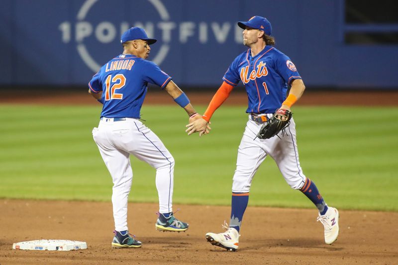 Jul 19, 2023; New York City, New York, USA;  New York Mets shortstop Francisco Lindor (12) and right fielder Jeff McNeil (1) celebrate after defeating the Chicago White Sox 5-1 at Citi Field. Mandatory Credit: Wendell Cruz-USA TODAY Sports