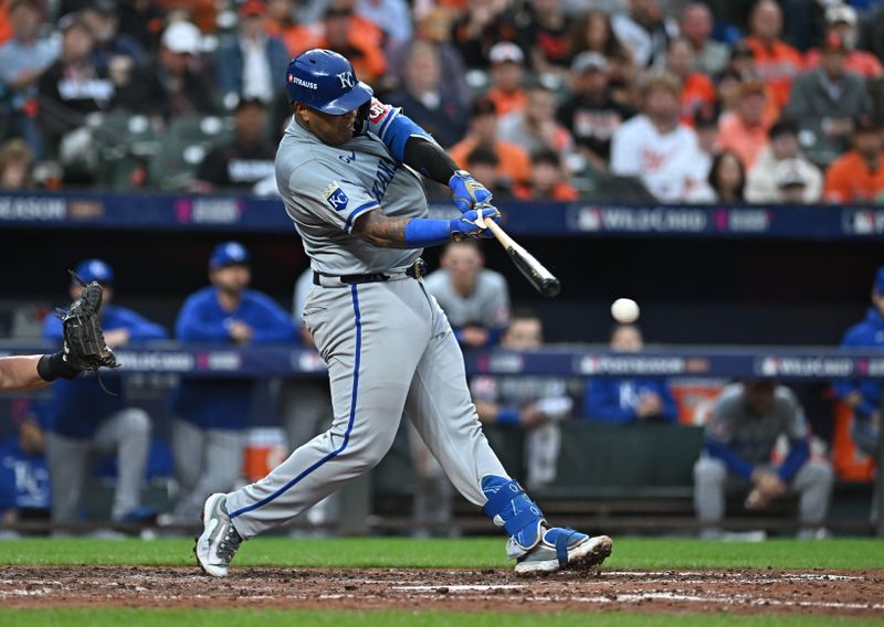 Oct 1, 2024; Baltimore, Maryland, USA; Kansas City Royals catcher Salvador Perez (13) hits a single at bat in the seventh inning in game one of the Wild Card round for the 2024 MLB Playoffs at Oriole Park at Camden Yards. Mandatory Credit: Tommy Gilligan-Imagn Images