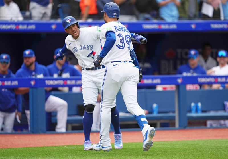 Sep 10, 2023; Toronto, Ontario, CAN; Toronto Blue Jays center fielder Kevin Kiermaier (39) hits a home run and celebrates with right fielder George Springer (4) against the Kansas City Royals during the seventh inning at Rogers Centre. Mandatory Credit: Nick Turchiaro-USA TODAY Sports