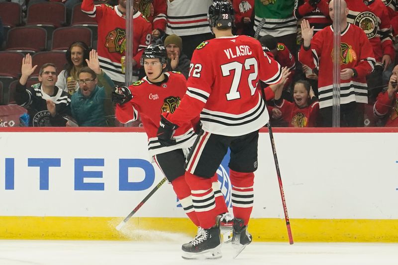 Dec 1, 2024; Chicago, Illinois, USA; Chicago Blackhawks center Connor Bedard (98) celebrates his goal against the Columbus Blue Jackets during the first period at United Center. Mandatory Credit: David Banks-Imagn Images