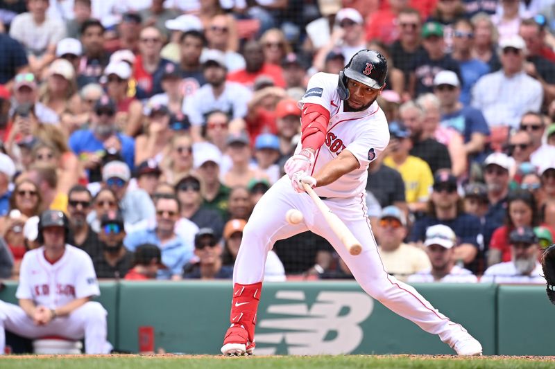 Aug 11, 2024; Boston, Massachusetts, USA; Boston Red Sox first baseman Dominic Smith (2) hits a single against the Houston Astros during the fifth inning at Fenway Park. Mandatory Credit: Eric Canha-USA TODAY Sports