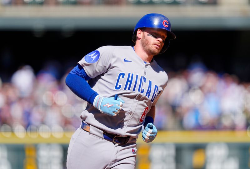 Aug 31, 2025; Denver, Colorado, USA; Chicago Cubs left fielder Ian Happ (8) runs off a three-run home run in the eighth inning against the Colorado Rockies at Coors Field. Mandatory Credit: Ron Chenoy-Imagn Images
