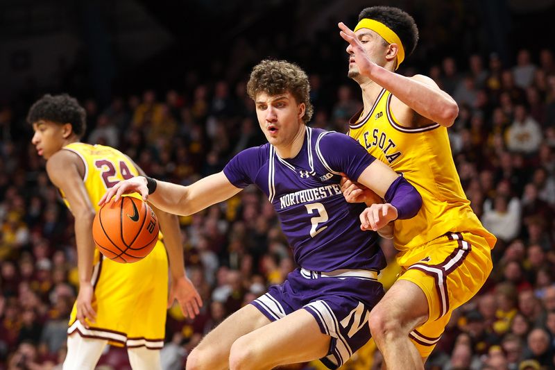 Feb 3, 2024; Minneapolis, Minnesota, USA; Northwestern Wildcats forward Nick Martinelli (2) dribbles as Minnesota Golden Gophers forward Dawson Garcia (3) defends during the second half at Williams Arena. Mandatory Credit: Matt Krohn-USA TODAY Sports