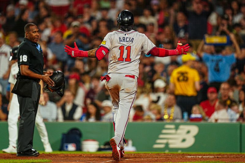 Jun 4, 2024; Boston, Massachusetts, USA; Atlanta Braves shortstop Orlando Arcia (11) hits a home run against the Boston Red Sox in the seventh inning at Fenway Park. Mandatory Credit: David Butler II-USA TODAY Sports