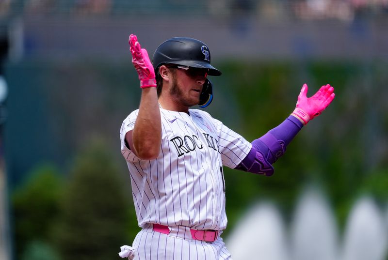 May 11, 2025; Denver, Colorado, USA; Colorado Rockies catcher Hunter Goodman (15) celebrates his three run home run in the first inning against the San Diego Padres at Coors Field. Mandatory Credit: Ron Chenoy-Imagn Images