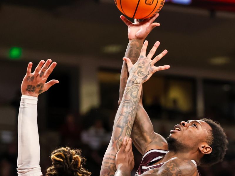 Jan 6, 2024; Columbia, South Carolina, USA; Mississippi State Bulldogs guard Dashawn Davis (10) shoots over South Carolina Gamecocks guard Myles Stute (10) in the second half at Colonial Life Arena. Mandatory Credit: Jeff Blake-USA TODAY Sports