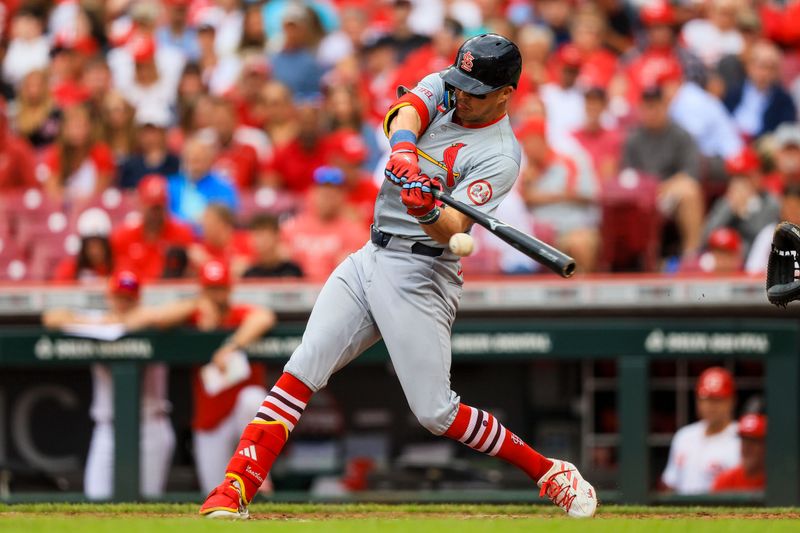 May 29, 2024; Cincinnati, Ohio, USA; St. Louis Cardinals outfielder Lars Nootbaar (21) hits a single against the Cincinnati Reds in the third inning at Great American Ball Park. Mandatory Credit: Katie Stratman-USA TODAY Sports