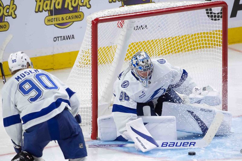 Oct 19, 2024; Ottawa, Ontario, CAN; Tampa Bay Lightning goalie Andrei Vasilevskiy (88) makes a save in the third period against the Ottawa Senators at the Canadian Tire Centre. Mandatory Credit: Marc DesRosiers-Imagn Images