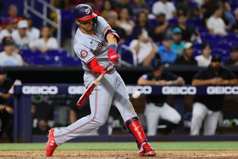 Apr 26, 2024; Miami, Florida, USA; Washington Nationals first baseman Joey Meneses (45) hits a two-run single against the Miami Marlins during the eighth inning at loanDepot Park. Mandatory Credit: Sam Navarro-USA TODAY Sports