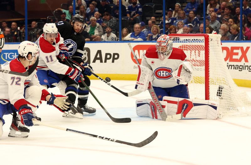 Mar 2, 2024; Tampa, Florida, USA; Montreal Canadiens goaltender Cayden Primeau (30) and right wing Brendan Gallagher (11) defend the puck from Tampa Bay Lightning center Anthony Cirelli (71)  during the first period at Amalie Arena. Mandatory Credit: Kim Klement Neitzel-USA TODAY Sports