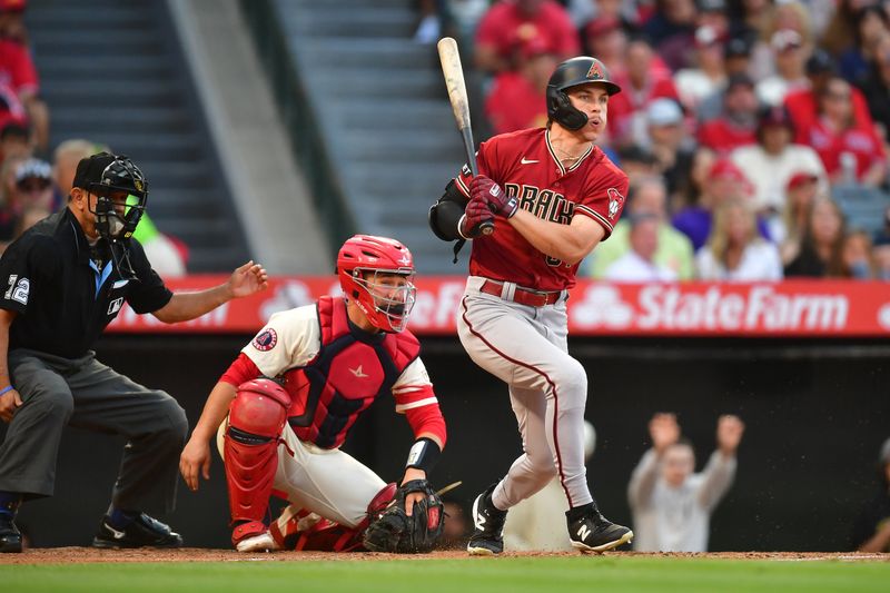 Jul 1, 2023; Anaheim, California, USA; Arizona Diamondbacks right fielder Jake McCarthy (31) reaches first on a fielders choice against the Los Angeles Angels during the second inning at Angel Stadium. Mandatory Credit: Gary A. Vasquez-USA TODAY Sports