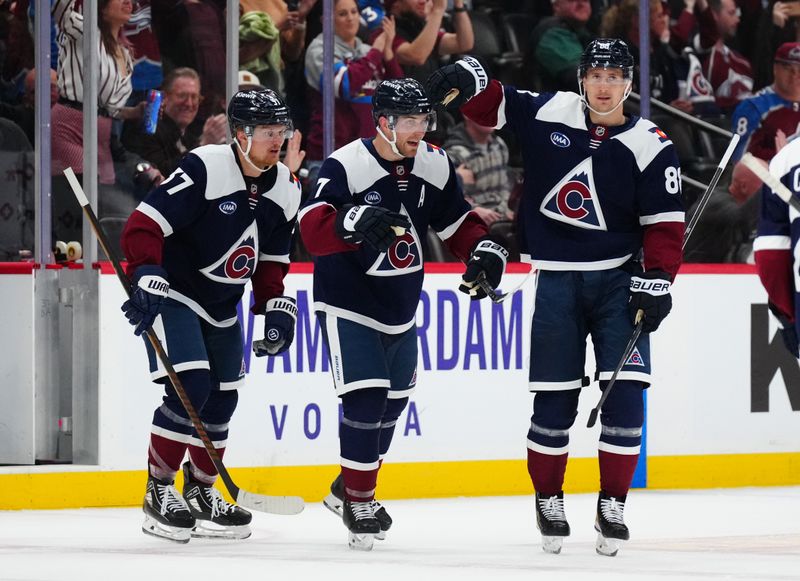 Feb 28, 2025; Denver, Colorado, USA; Colorado Avalanche defenseman Devon Toews (7), center Casey Mittelstadt (37) and center Martin Necas (88) celebrate defeating the Minnesota Wild at Ball Arena. Mandatory Credit: Ron Chenoy-Imagn Images