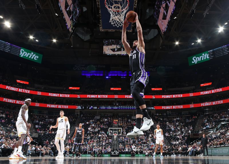 SALT LAKE CITY, UT - OCTOBER 15: Domantas Sabonis #11 of the Sacramento Kings dunks the ball during the game against the Utah Jazz on October 15, 2024 at Delta Center in Salt Lake City, Utah. NOTE TO USER: User expressly acknowledges and agrees that, by downloading and or using this Photograph, User is consenting to the terms and conditions of the Getty Images License Agreement. Mandatory Copyright Notice: Copyright 2024 NBAE (Photo by Melissa Majchrzak/NBAE via Getty Images)