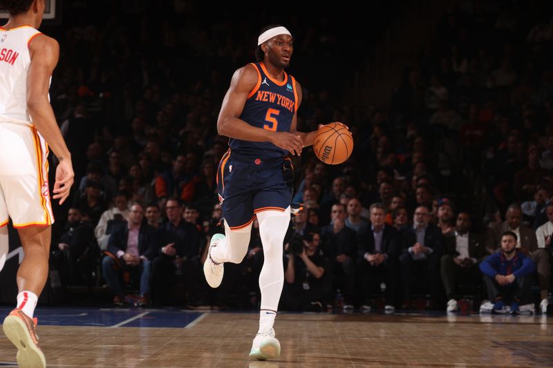 NEW YORK, NY - MARCH 5: Precious Achiuwa #5 of the New York Knicks handles the ball during the game against the Atlanta Hawks on March 5, 2024 at Madison Square Garden in New York City, New York.  NOTE TO USER: User expressly acknowledges and agrees that, by downloading and or using this photograph, User is consenting to the terms and conditions of the Getty Images License Agreement. Mandatory Copyright Notice: Copyright 2024 NBAE  (Photo by Nathaniel S. Butler/NBAE via Getty Images)