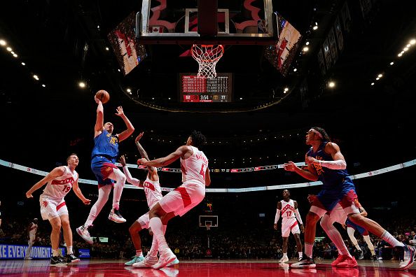 TORONTO, CANADA - DECEMBER 20:  Nikola Jokic #15 of the Denver Nuggets goes to the basket during the game on December 20, 2023 at the Scotiabank Arena in Toronto, Ontario, Canada.  NOTE TO USER: User expressly acknowledges and agrees that, by downloading and or using this Photograph, user is consenting to the terms and conditions of the Getty Images License Agreement.  Mandatory Copyright Notice: Copyright 2023 NBAE (Photo by Mark Blinch/NBAE via Getty Images)