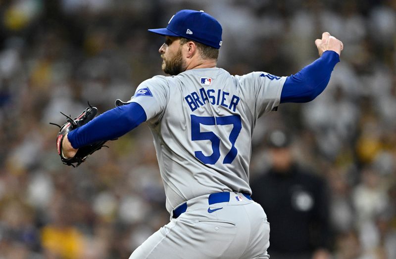 Oct 9, 2024; San Diego, California, USA; Los Angeles Dodgers pitcher Ryan Brasier (57) throws in the first inning against the San Diego Padres during game four of the NLDS for the 2024 MLB Playoffs at Petco Park.  Mandatory Credit: Denis Poroy-Imagn Images