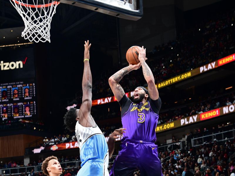 ATLANTA, GA - DECEMBER 6: Anthony Davis #3 of the Los Angeles Lakers shoots the ball during the game against the Atlanta Hawks on December 6, 2024 at State Farm Arena in Atlanta, Georgia.  NOTE TO USER: User expressly acknowledges and agrees that, by downloading and/or using this Photograph, user is consenting to the terms and conditions of the Getty Images License Agreement. Mandatory Copyright Notice: Copyright 2024 NBAE (Photo by Scott Cunningham/NBAE via Getty Images)