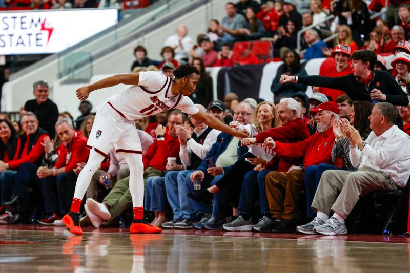 Feb 7, 2026; Raleigh, North Carolina, USA;  NC State Wolfpack guard Quadir Copeland (11) thanks the fans during the second half of the game against the Virginia Tech Hokies at Lenovo Center. Mandatory Credit: Jaylynn Nash-Imagn Images