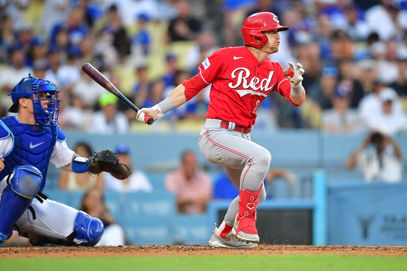 Jul 29, 2023; Los Angeles, California, USA; Cincinnati Reds center fielder TJ Friedl (29) hits a single against the Los Angeles Dodgers during the sixth inning at Dodger Stadium. Mandatory Credit: Gary A. Vasquez-USA TODAY Sports