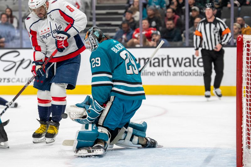 Nov 27, 2023; San Jose, California, USA; San Jose Sharks goaltender Mackenzie Blackwood (29) makes a save against Washington Capitals left wing Alex Ovechkin (8) during the first period at SAP Center at San Jose. Mandatory Credit: Neville E. Guard-USA TODAY Sports