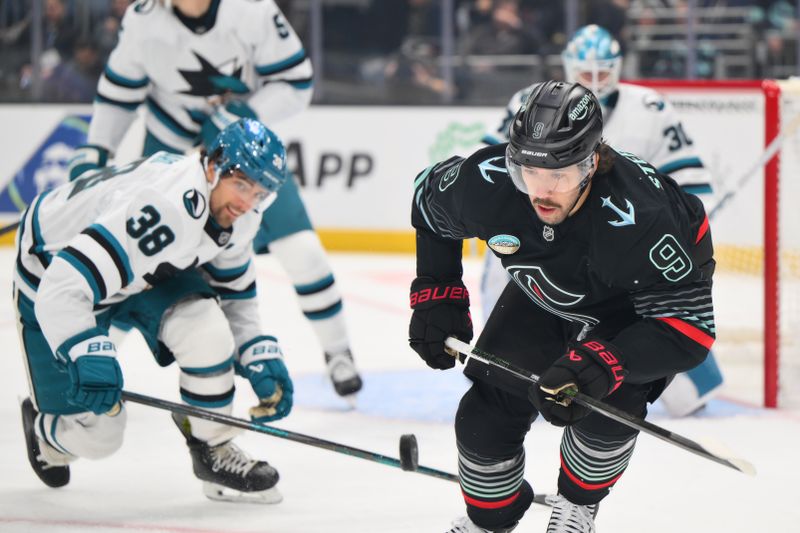 Nov 5, 2025; Seattle, Washington, USA; Seattle Kraken center Chandler Stephenson (9) chases the loos puck during the second period against the San Jose Sharks at Climate Pledge Arena. Mandatory Credit: Steven Bisig-Imagn Images