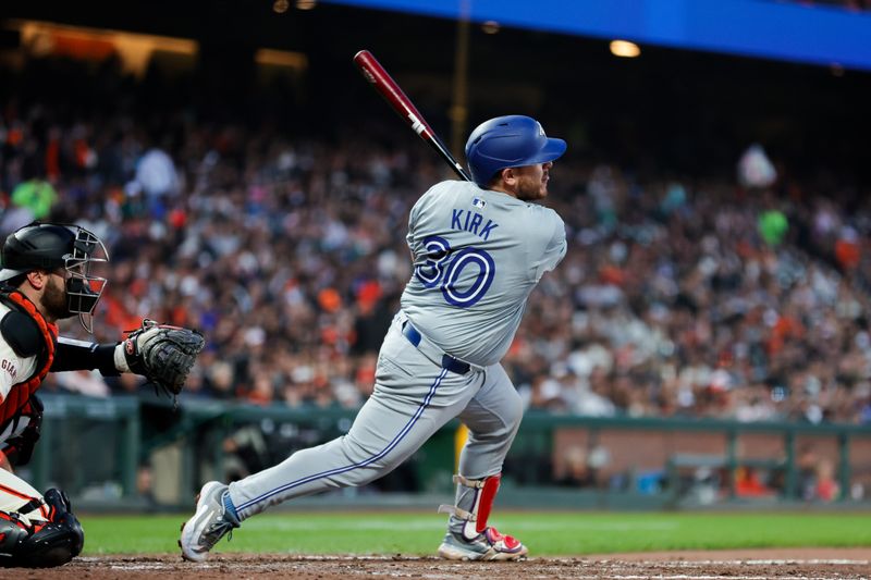 Jul 10, 2024; San Francisco, California, USA; Toronto Blue Jays catcher Alejandro Kirk (30) hits a RBI single during the sixth inning against the San Francisco Giants at Oracle Park. Mandatory Credit: Sergio Estrada-USA TODAY Sports