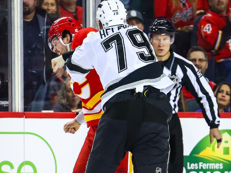 Nov 11, 2024; Calgary, Alberta, CAN; Calgary Flames center Justin Kirkland (58) and Los Angeles Kings center Samuel Helenius (79) fights during the second period at Scotiabank Saddledome. Mandatory Credit: Sergei Belski-Imagn Images