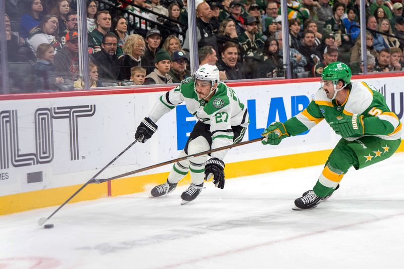 Nov 16, 2024; Saint Paul, Minnesota, USA; Dallas Stars left wing Mason Marchment (27) skates behind the Minnesota Wild net against Minnesota defenseman Jake Middleton (5) in the second period at Xcel Energy Center. Mandatory Credit: Matt Blewett-Imagn Images