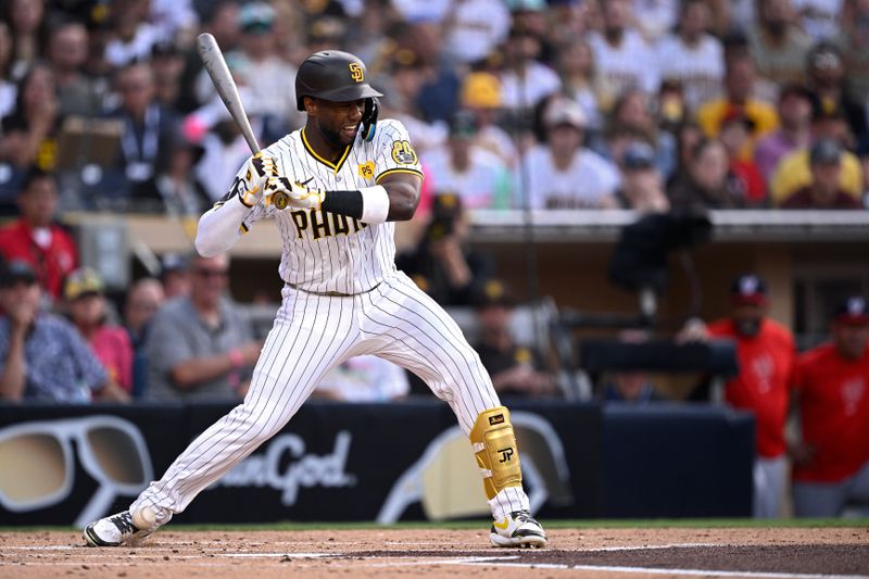 Jun 25, 2024; San Diego, California, USA; San Diego Padres left fielder Jurickson Profar (10) is hit by a pitch during the first inning against the Washington Nationals at Petco Park. Mandatory Credit: Orlando Ramirez-USA TODAY Sports