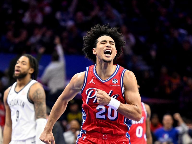 PHILADELPHIA, PENNSYLVANIA - NOVEMBER 22: Jared McCain #20 of the Philadelphia 76ers celebrates after scoring in the fourth quarter against the Brooklyn Nets in the NBA Emirates Cup at the Wells Fargo Center on November 22, 2024 in Philadelphia, Pennsylvania. NOTE TO USER: User expressly acknowledges and agrees that, by downloading and or using this photograph, User is consenting to the terms and conditions of the Getty Images License Agreement. (Photo by G Fiume/Getty Images)