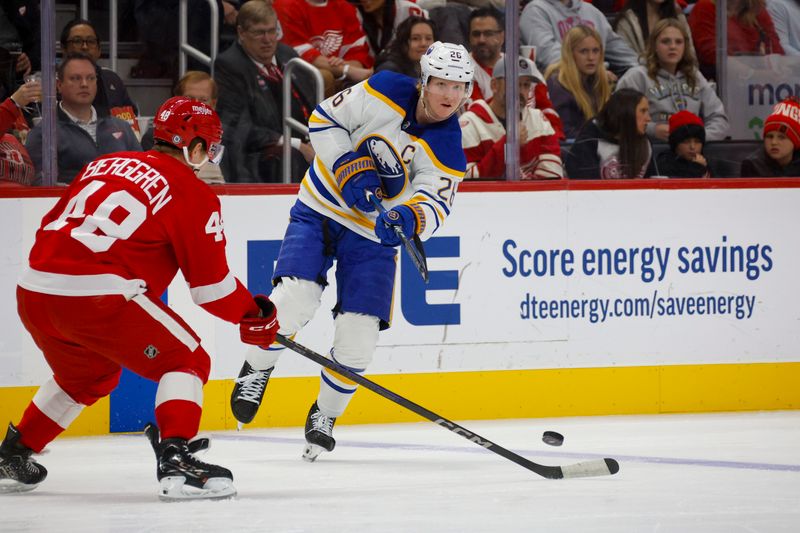 Nov 2, 2024; Detroit, Michigan, USA; Buffalo Sabres defenseman Rasmus Dahlin (26) passes the puck during the first inning of the game against the Detroit Red Wings at Little Caesars Arena. Mandatory Credit: Brian Bradshaw Sevald-Imagn Images